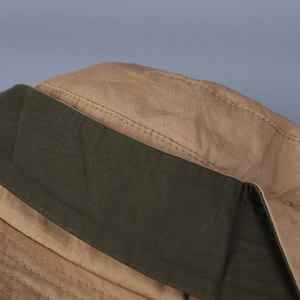 Detail of multi-row stitching on khaki and olive green washed cotton bucket hat