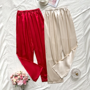 Luxurious satin silk loungewear pants in red and champagne colors with elastic waist