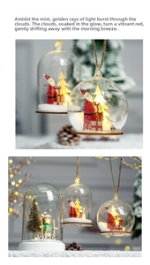 Close-up of lighted Christmas snow globe with Santa and wood base for holiday decor