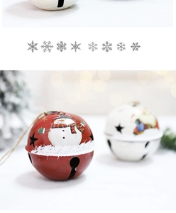 Close-up of red snowman and white Santa Claus metal Christmas bells with snowflakes