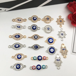 Selection of evil eye and Hamsa hand jewelry connectors in gold and silver plating