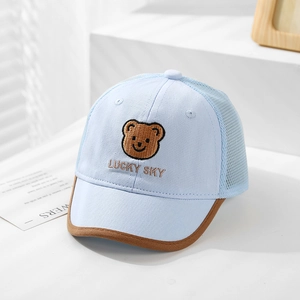 Close-up of Lucky Sky bear embroidery on breathable mesh baby baseball cap in light blue