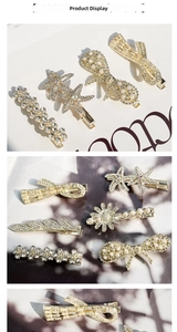 Detail of gold crystal hair clips with faux pearls and star-shaped rhinestone designs