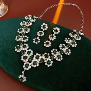 Luxury floral jewelry set featuring green crystal sunflower necklace and earrings