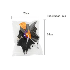 Halloween bat headband accessory with orange bow and dimensions 20x24x7cm displayed in pack