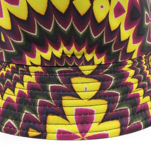 Vibrant yellow spiral tie-dye bucket hat with colorful psychedelic patterns for outdoors