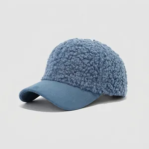 Close-up of blue sherpa kids baseball cap featuring fuzzy fleece and suede brim