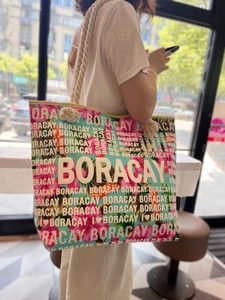 Close-up of tropical floral tote bag with thick cotton rope handles and Boracay print