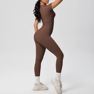 Detail view of deep brown short sleeve fitness set with high-waist stretch leggings