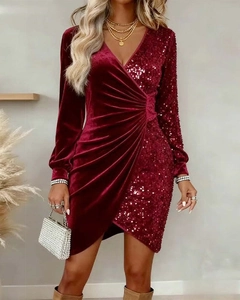 Detail of burgundy velvet and sequin V-neck dress featuring an asymmetrical patchwork design