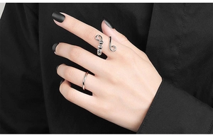 Detailed view of silver rotatable anxiety beads on an adjustable ring for women