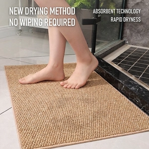 Sisal-style absorbent bathroom mat with non-slip texture in light camel weave