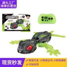 Close-up of the GECKO remote control lizard toy with a translucent green remote and its box