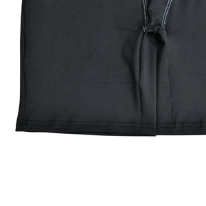 Close-up of the black ribbed fabric texture with white contrast stitching details