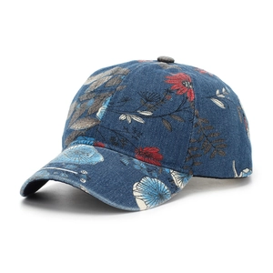 Detail of vintage floral print denim baseball cap with red daisies and blue hydrangeas