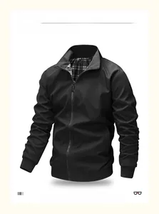 Detail of men's casual black jacket showing ribbed cuffs and classic plaid lining
