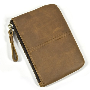 Detailed view of brown vintage crazy horse leather coin purse with a durable zipper closure