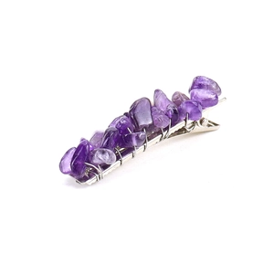 Detailed close-up of natural purple amethyst stones on a silver duckbill hair clip