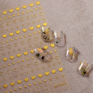 Golden heart nail art stickers M-047 with relief texture and metallic finish on film