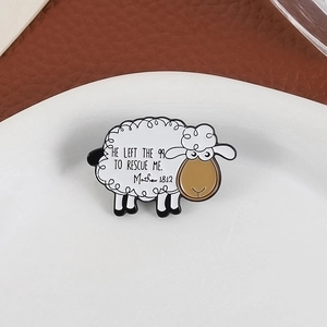 Cartoon sheep enamel brooch with Matthew 18:12 scripture on white plate background