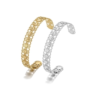 Detailed view of hollow floral pattern bangle bracelets in gold and silver finish