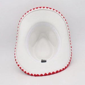 Detailed interior of a white jazz hat featuring red wavy trim and internal sweatband detail