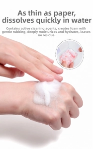Portable soap flakes dissolving into rich white foam for travel hand washing