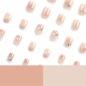 Short square gradient press-on nails with white flower patterns and rhinestone accents