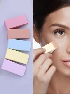 Detail of wedge-shaped makeup sponges in multiple colors showing texture and facial usage