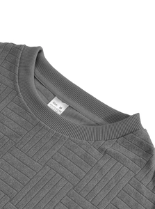 Close-up of crew neckline and breathable jacquard fabric texture on grey men set