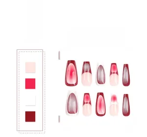 Detail of red and nude pink ombre French press-on nails with cat eye shimmer finish