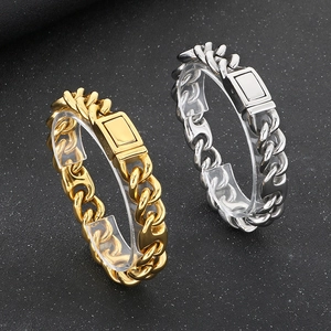 Close-up of hip hop Cuban link bracelet with mixed square buckle in gold and silver