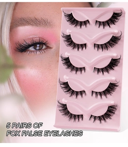 Detail view of five pairs of fox-style false eyelashes with elongated eye-end on pink tray