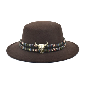 Flat top brown wool fedora hat with ethnic band and golden bull skull ornament