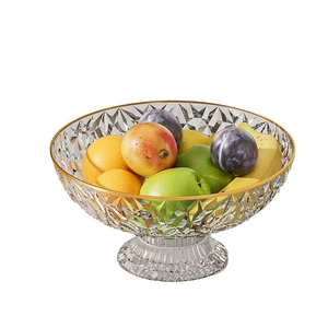 Elegant crystal glass fruit plate with gold rim and diamond pattern on a high stand