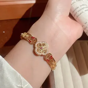 Vintage gold cuff bracelet with clover motif, pearls, and red zircon for women