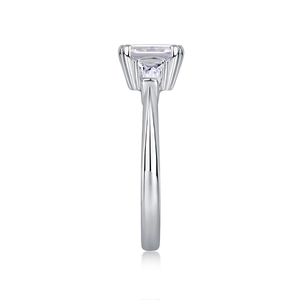 Side view of an emerald-cut moissanite ring with trapezoid side stones in S925 sterling silver