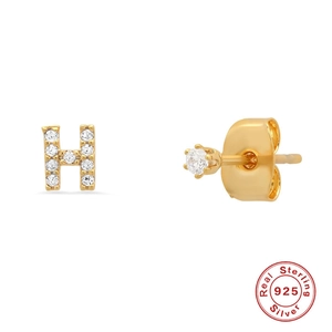 Detail view of gold S925 sterling silver letter H earring with sparkling zircon stones