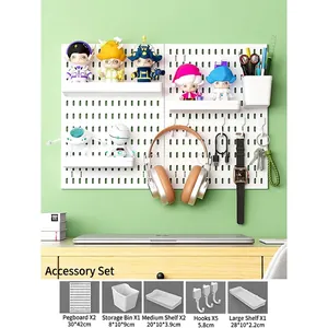 Wall-mounted white pegboard set with shelves and hooks for desk organization