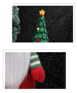 Close-up of handmade Christmas gnome with long white beard and green felt tree texture