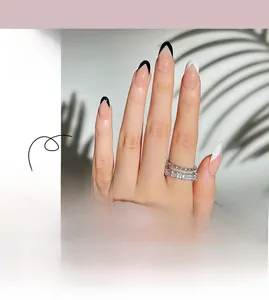 Detail of French style press-on nails with minimalist black and white tip design