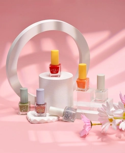 Water-based peelable nail polish set with six vibrant colors on white geometric props