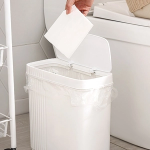 White narrow press-top trash can with vertical texture for bathroom and kitchen space