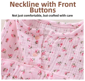 Detail of pink floral baby pajamas showing breathable cotton gauze and front snap buttons