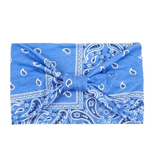Close-up of light blue paisley sport headband with high-elasticity knitted fabric texture