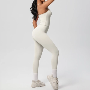 Detail of a beige slim-fit yoga set featuring a strapless tank top and high-waisted leggings