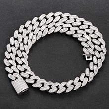 Close-up of a silver 15mm Cuban link chain bracelet with pave-set stones in detail