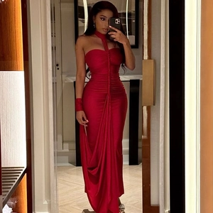 Detailed view of the red bodycon dress featuring elegant side ruching and a slim silhouette