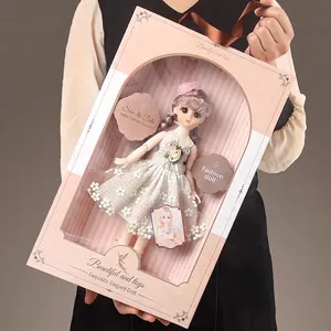 Fashion doll in lace dress inside a pink heart-window gift box for girls