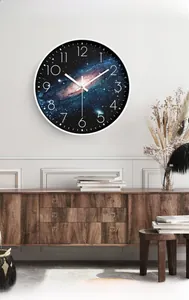 Close-up of starry sky wall clock with large numbers in a modern minimalist living room
